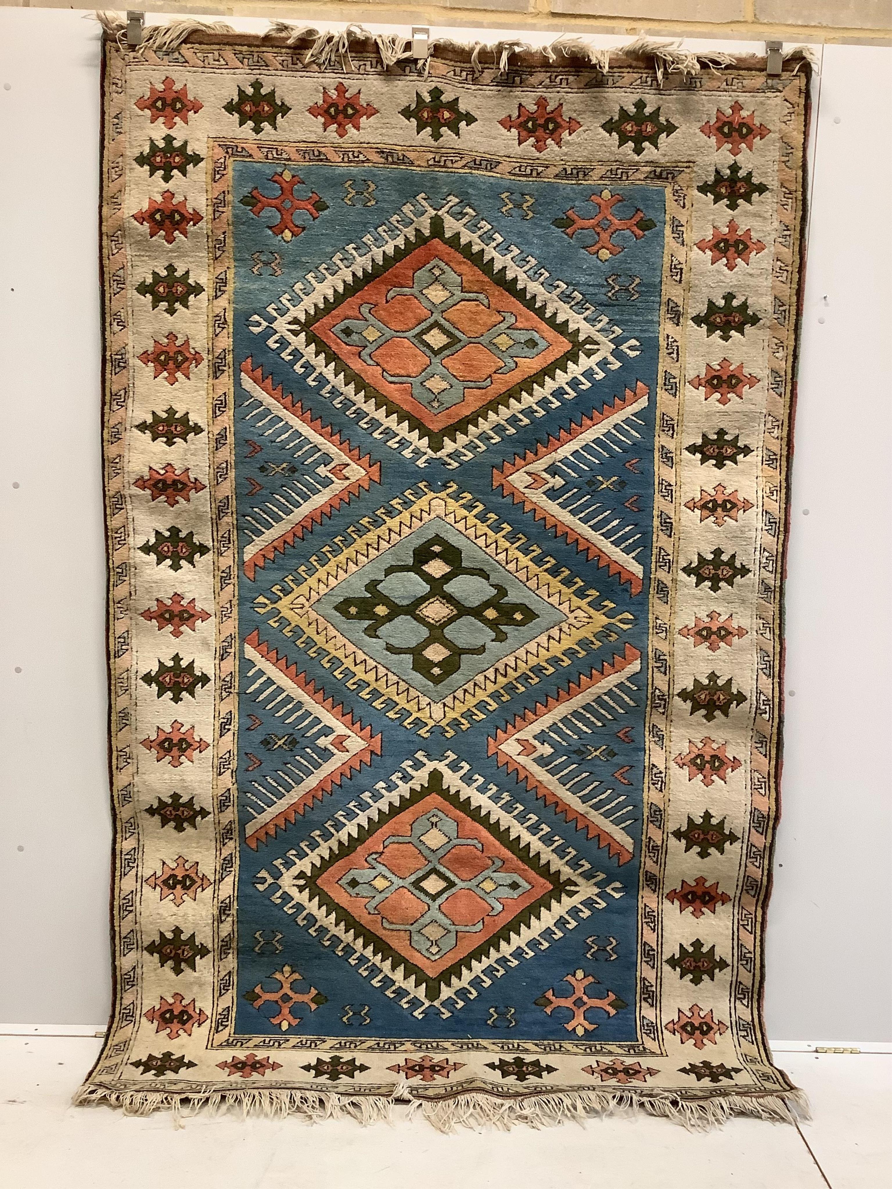 A Caucasian style blue ground rug, 260 x 160cm. Condition - fair